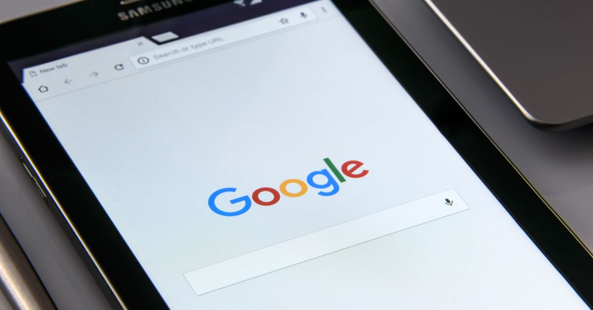 Close-up of a tablet displaying Google's search screen, emphasizing technology and internet browsing.